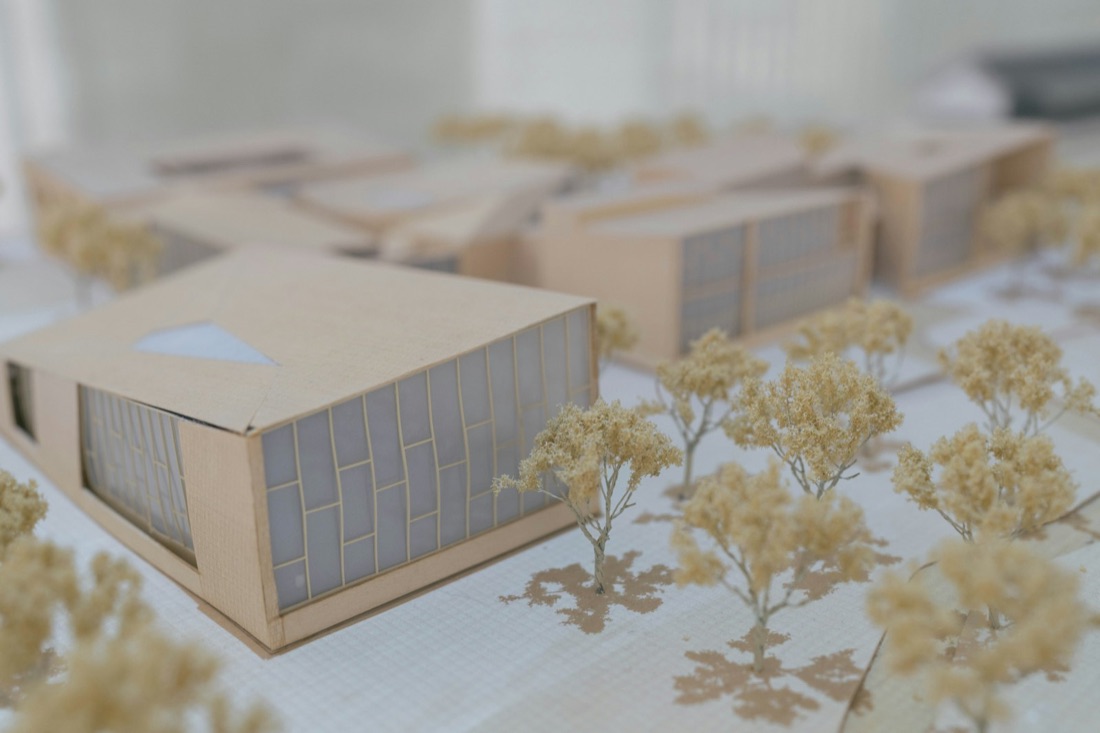 Architect's desk with drawings and a scale model